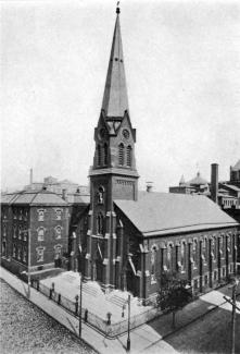 Aerial view of St. Peter's Church and academy, showing corner of Hicks and Warren Streets.